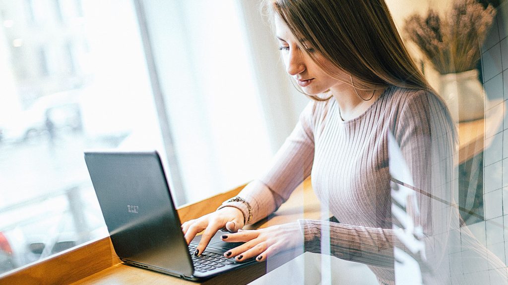 consultant typing on laptop image